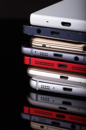 heap-electronical-devices-close-up-smartphones-black-background_641010-2523